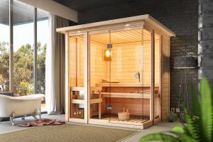 Entspannte Stunden im persönlichen Spa: Durch ihre Klarglas-Front bietet die Sauna Paavo von Karibu einen besonders hellen Innenraum. Bild: HELLWEG